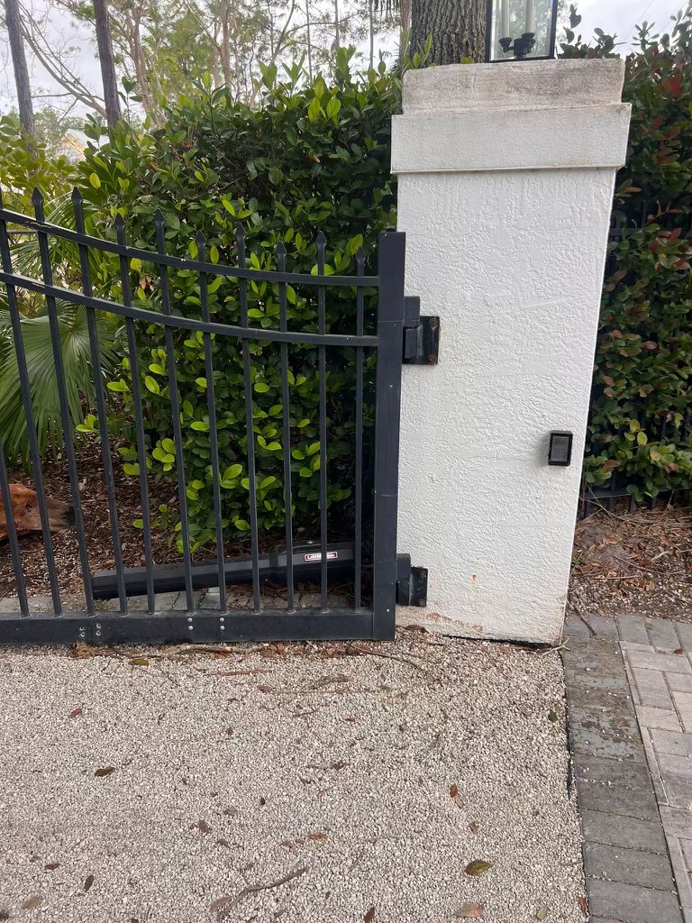 Metal gate with keypad access control on stucco pillar in Los Angeles, CA
