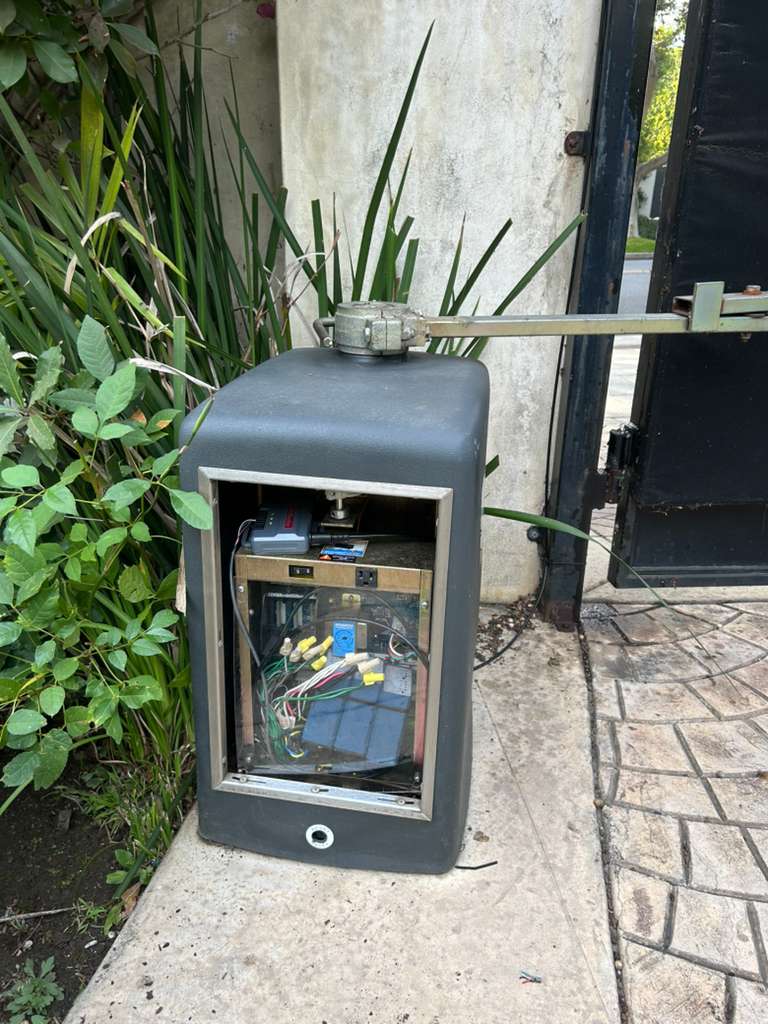 Open gate control box with exposed wiring and components in Mid-Wilshire, CA
